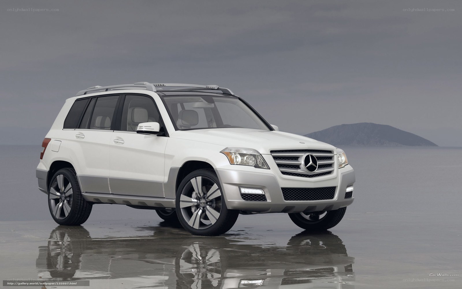 White Mercedes-Benz SUV on beach