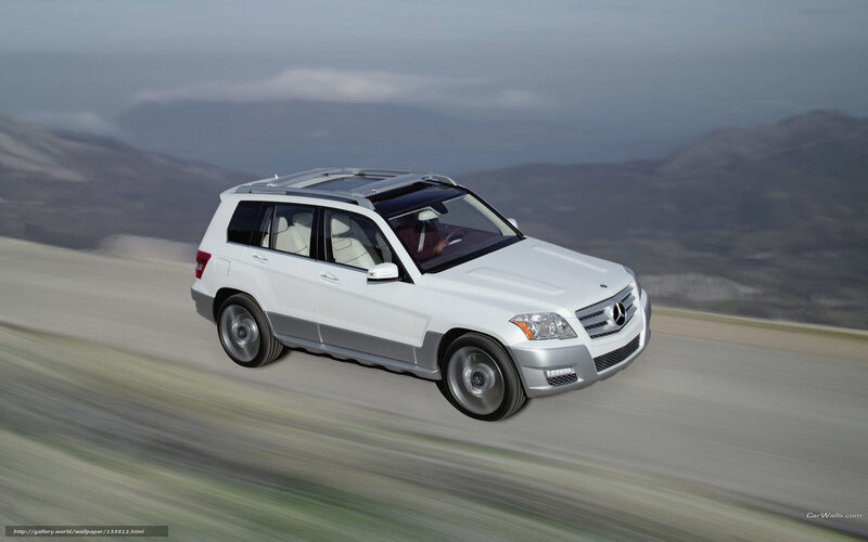 White Mercedes-Benz SUV on mountain road