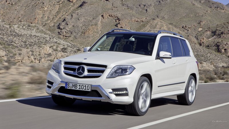 white mercedes-benz suv on road