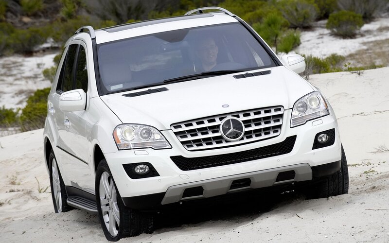 White Mercedes-Benz SUV on sand