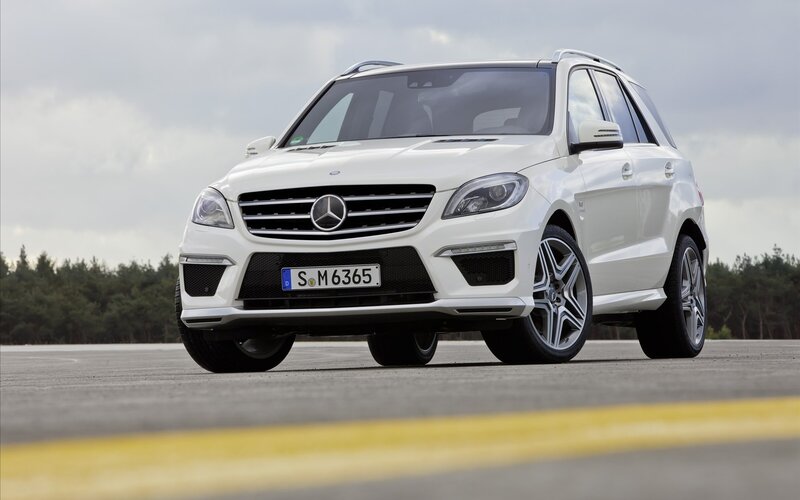 White Mercedes-Benz SUV on track