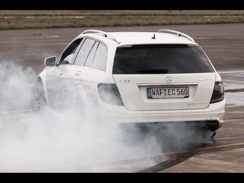 white mercedes c63 amg drifting