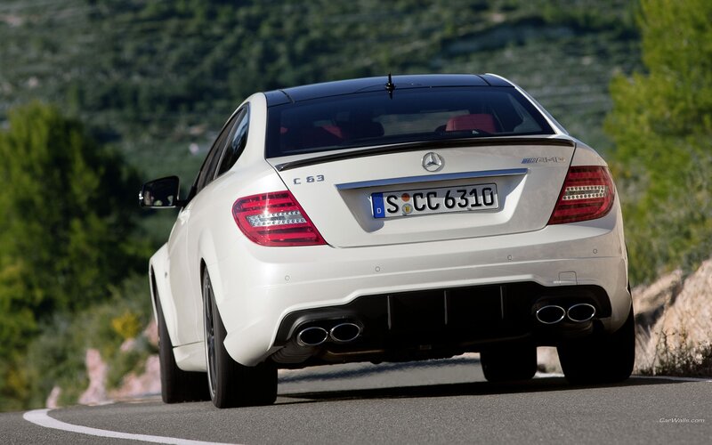 white mercedes c63 amg on road