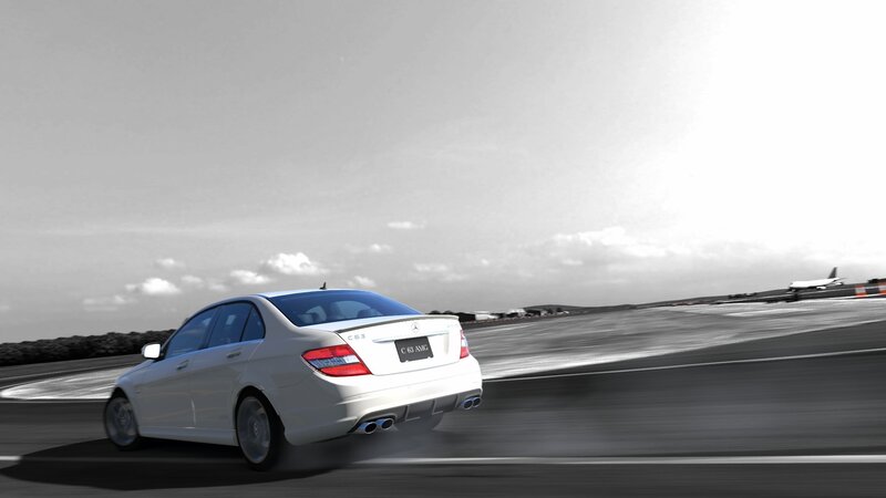 White Mercedes C63 AMG on track