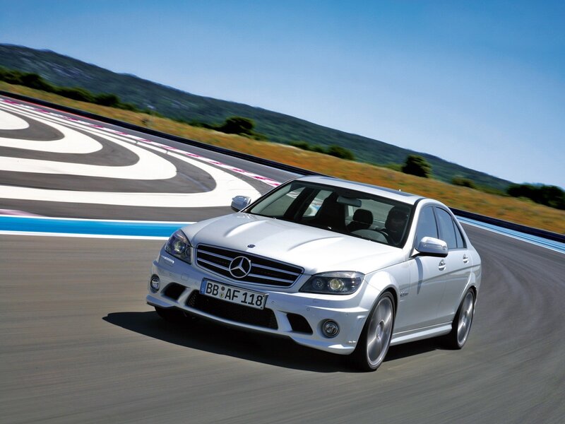 white mercedes c63 amg on track