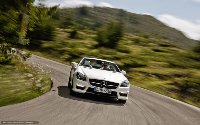 white mercedes convertible on winding road