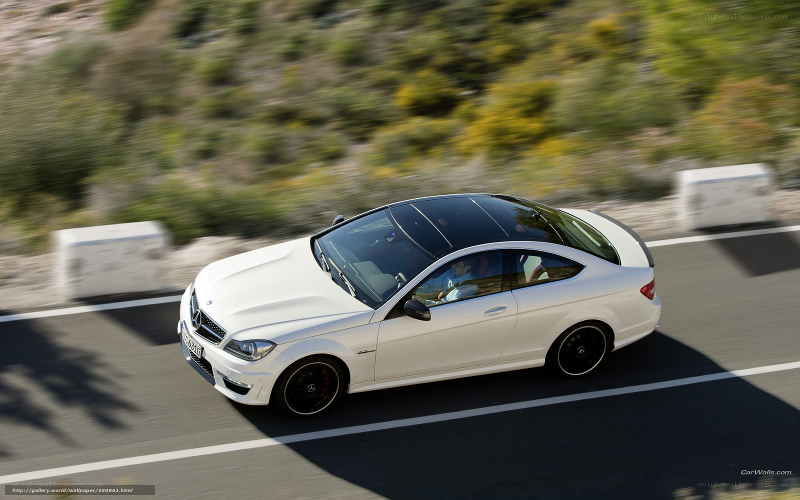 white mercedes-coupe in motion