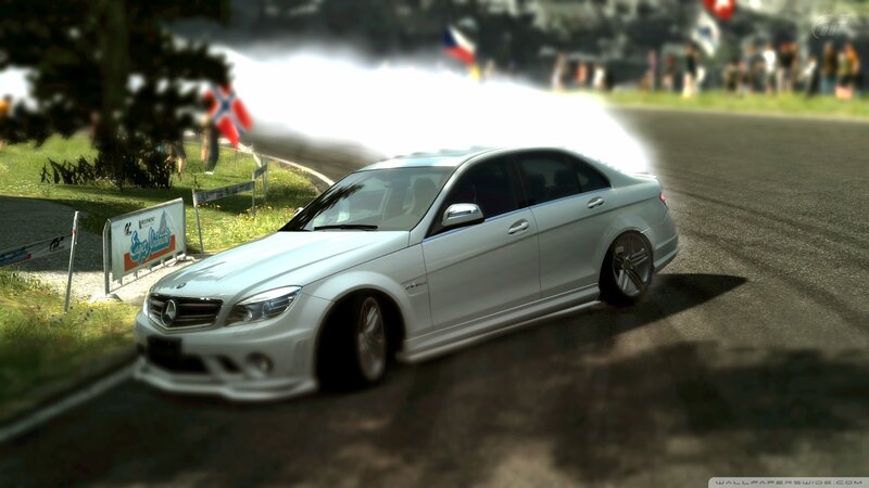 white mercedes drifts on track