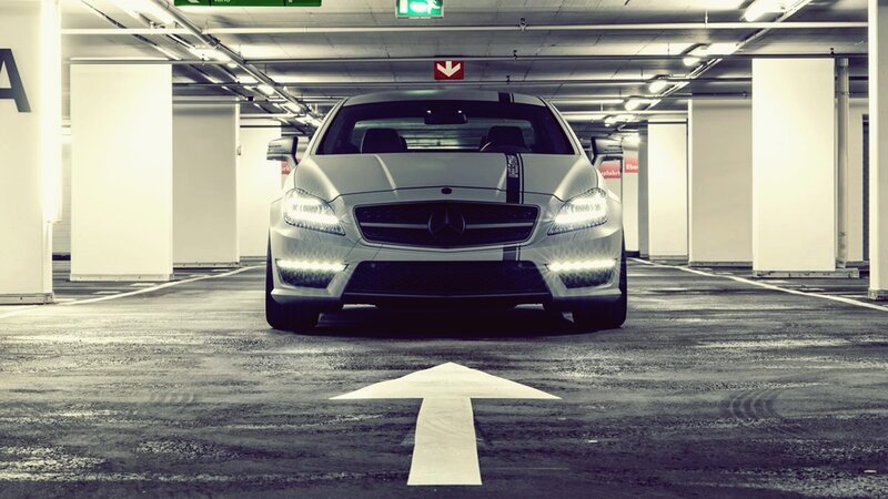 white mercedes in parking garage