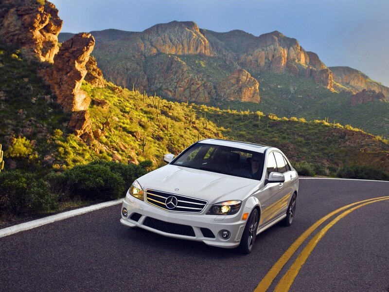 White Mercedes on a mountain road