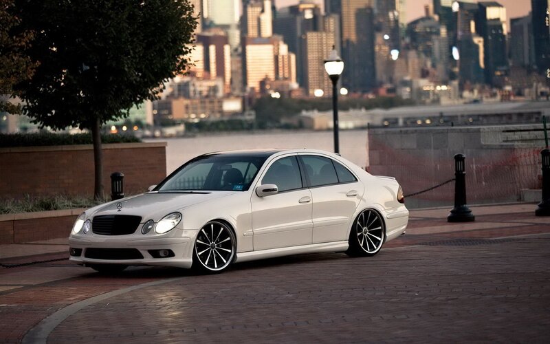 white mercedes sedan in city
