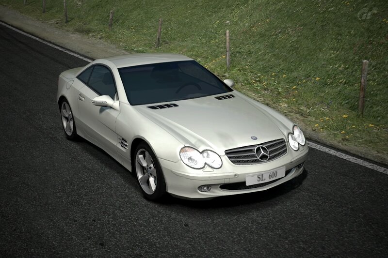 white mercedes sl600 on road