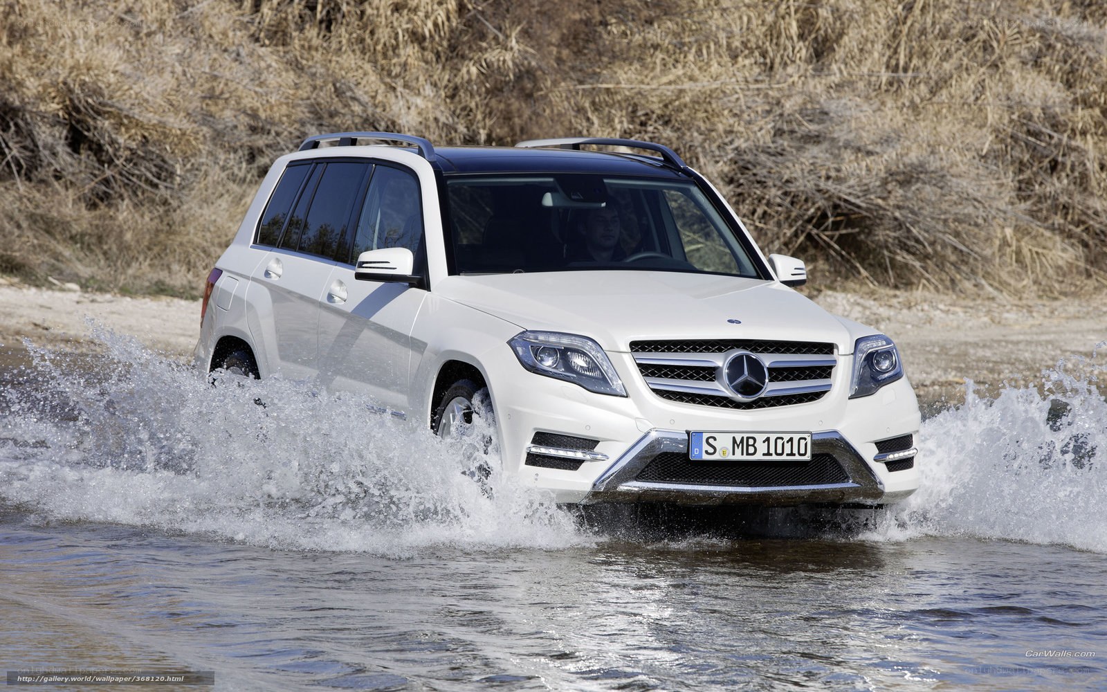 white mercedes suv crossing river