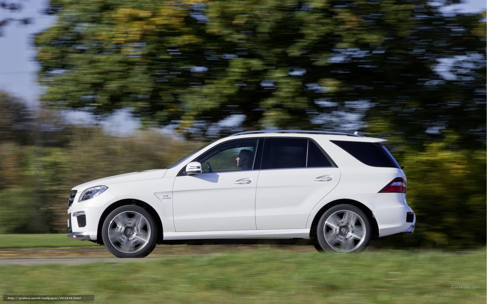 white mercedes suv in motion
