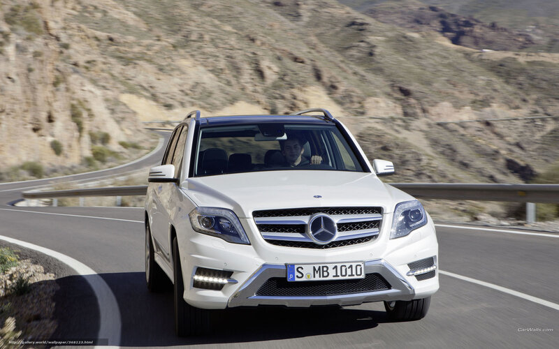 white mercedes suv on mountain road