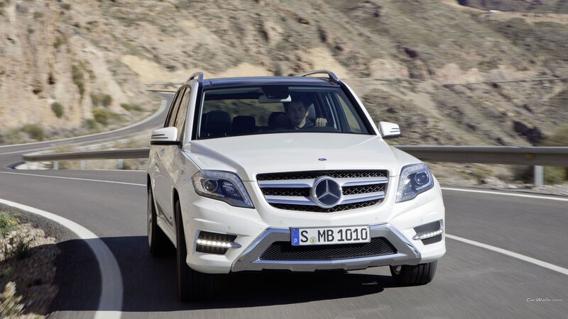 white mercedes suv on mountain road