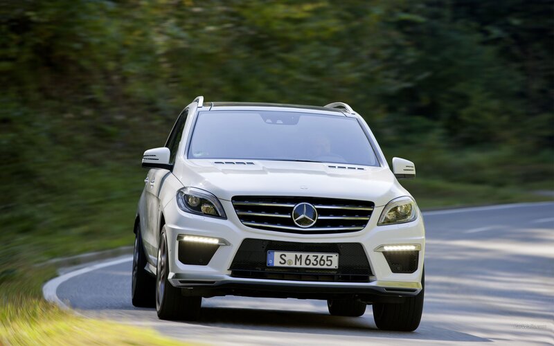 white mercedes suv on road