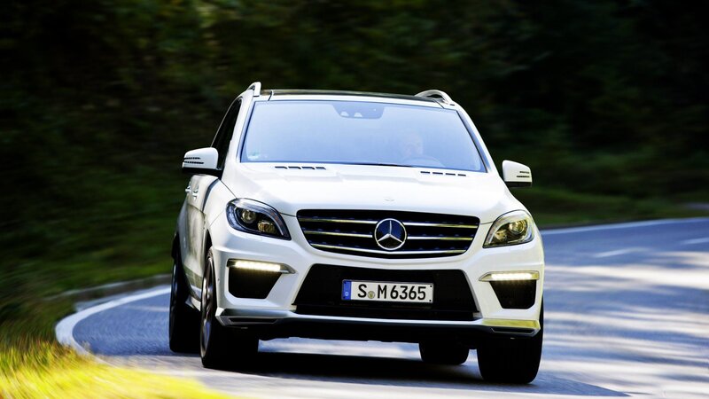 white mercedes suv on road