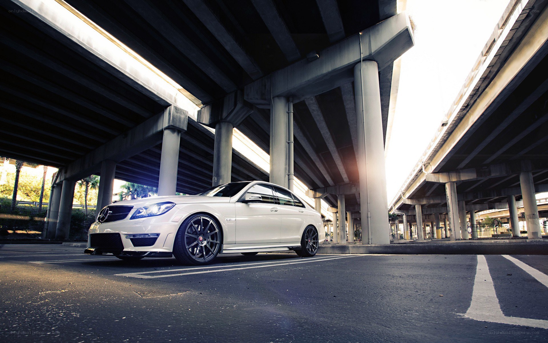 white mercedes under highway
