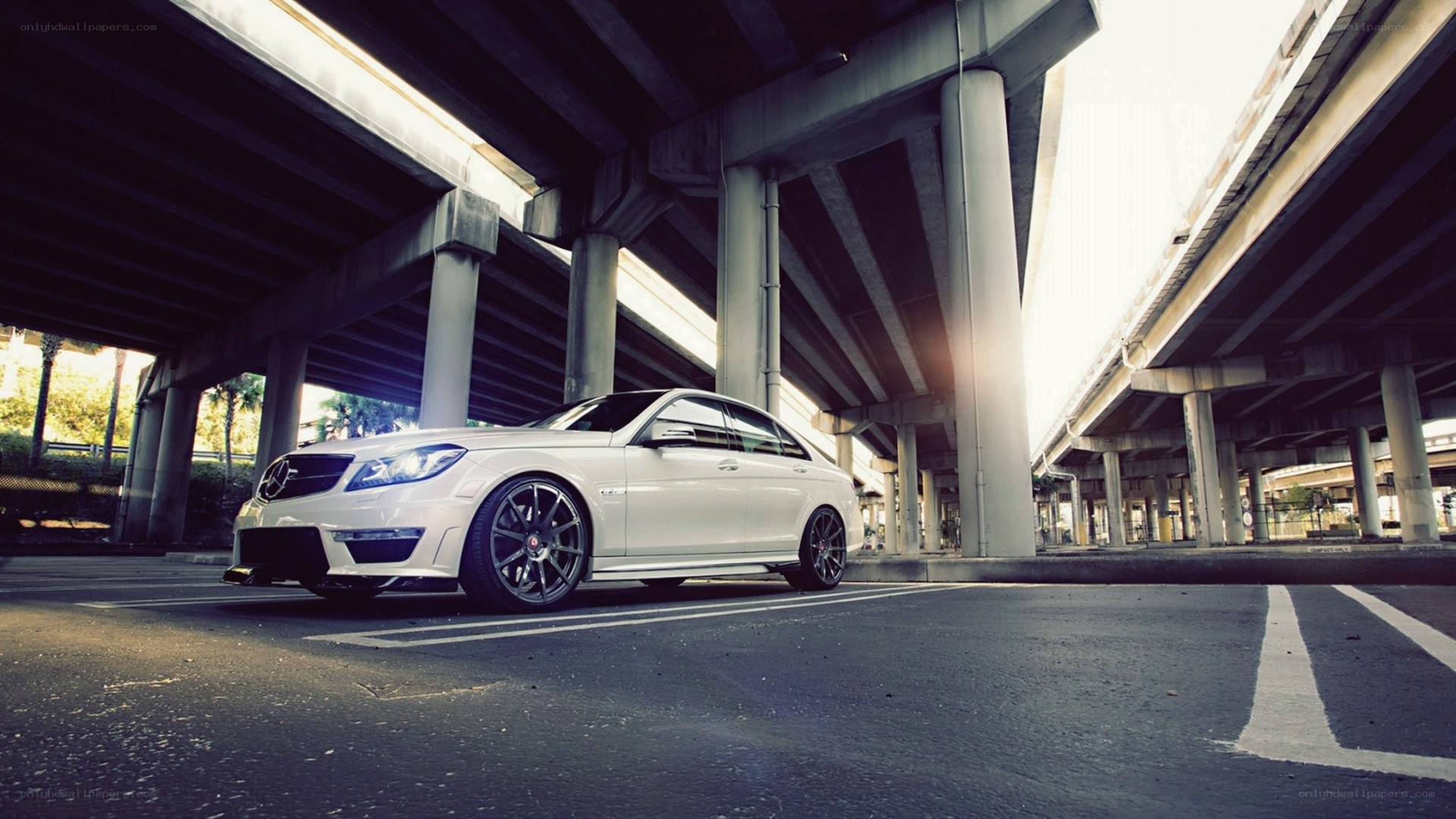 white mercedes under highway