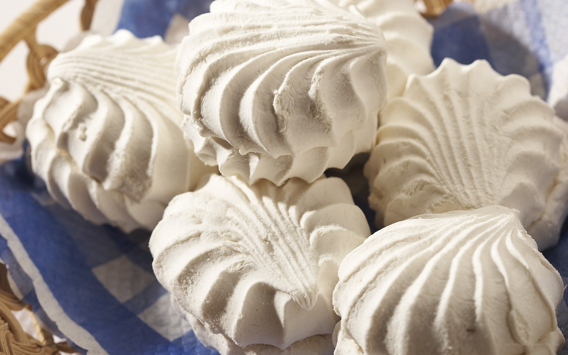 White meringue cookies in basket