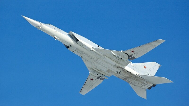 White military jet in flight