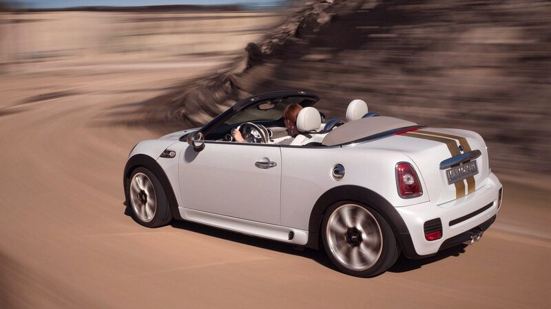 white mini convertible driving