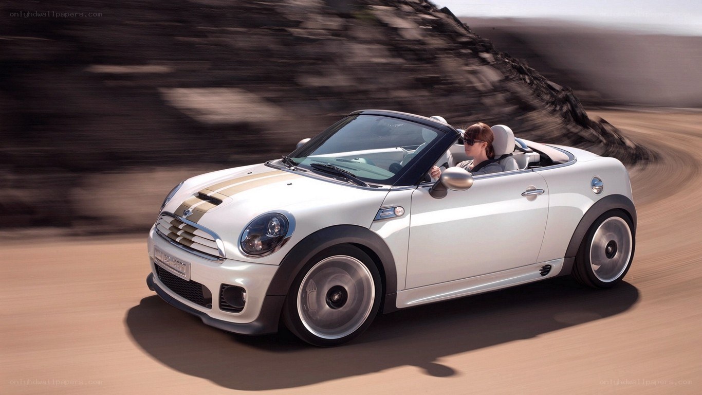 white mini convertible driving