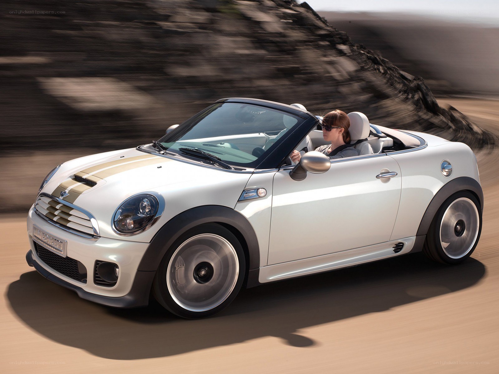 White MINI convertible driving