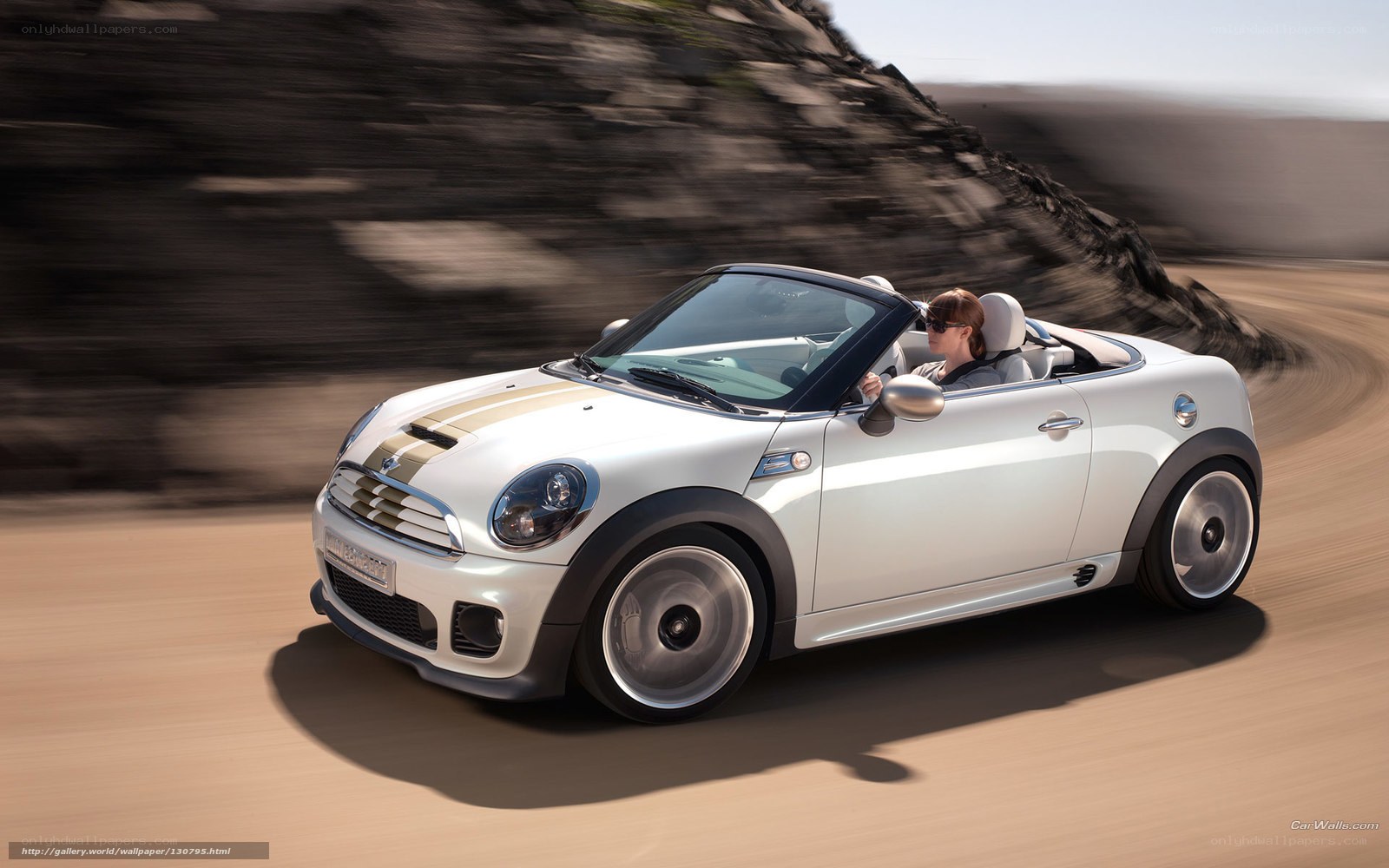White MINI convertible driving