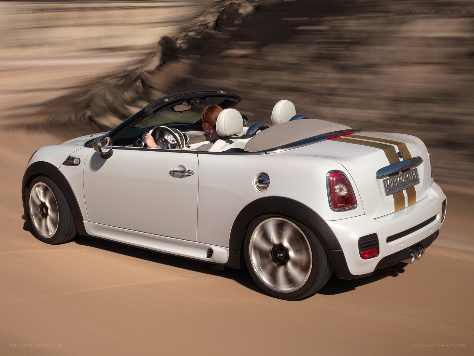 White MINI convertible in motion