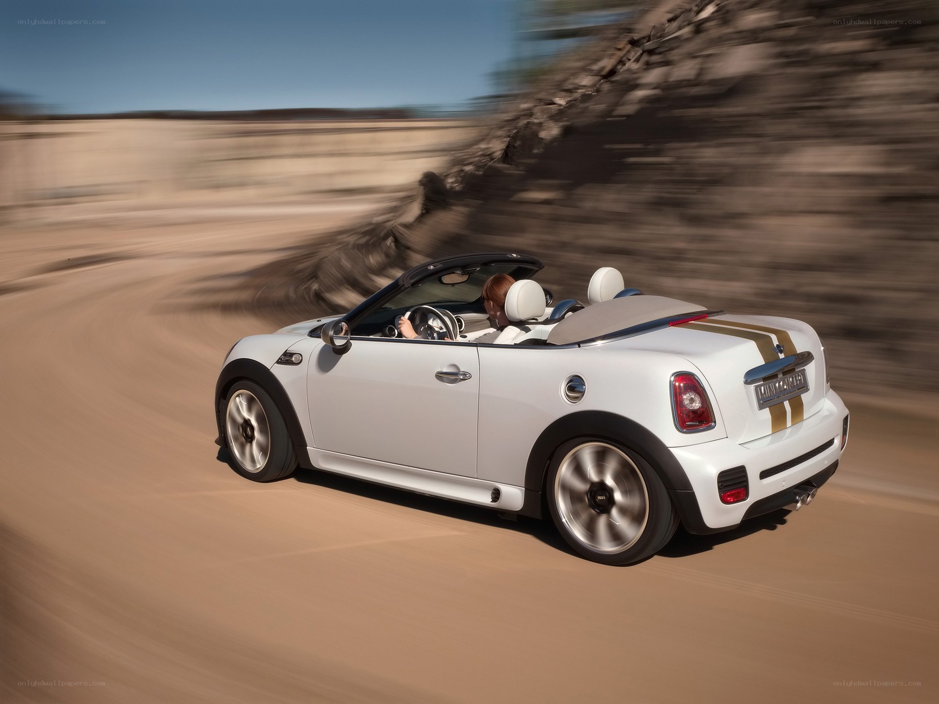 White MINI convertible on desert road