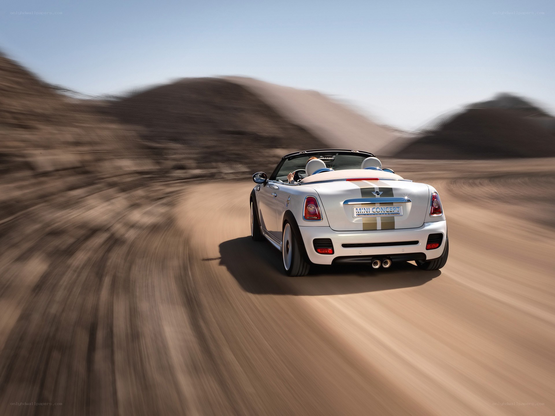 White MINI convertible on desert road