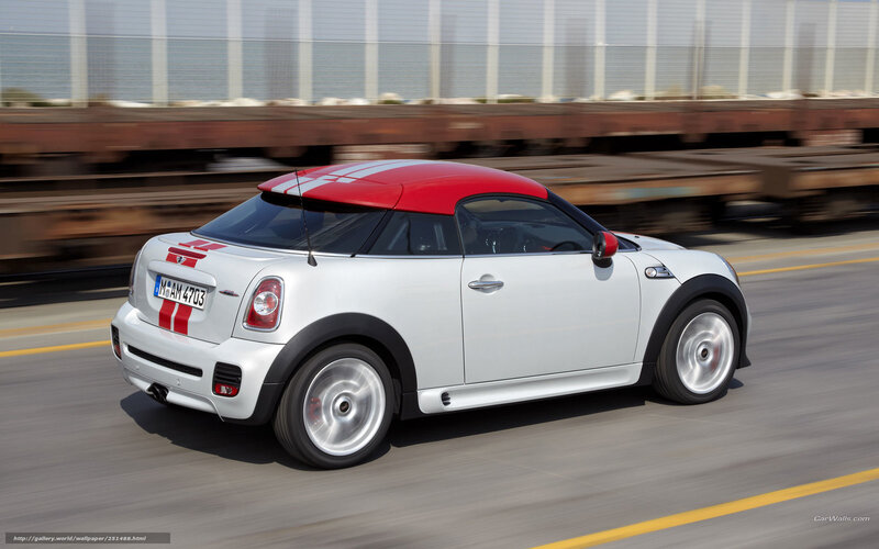 white mini cooper in motion