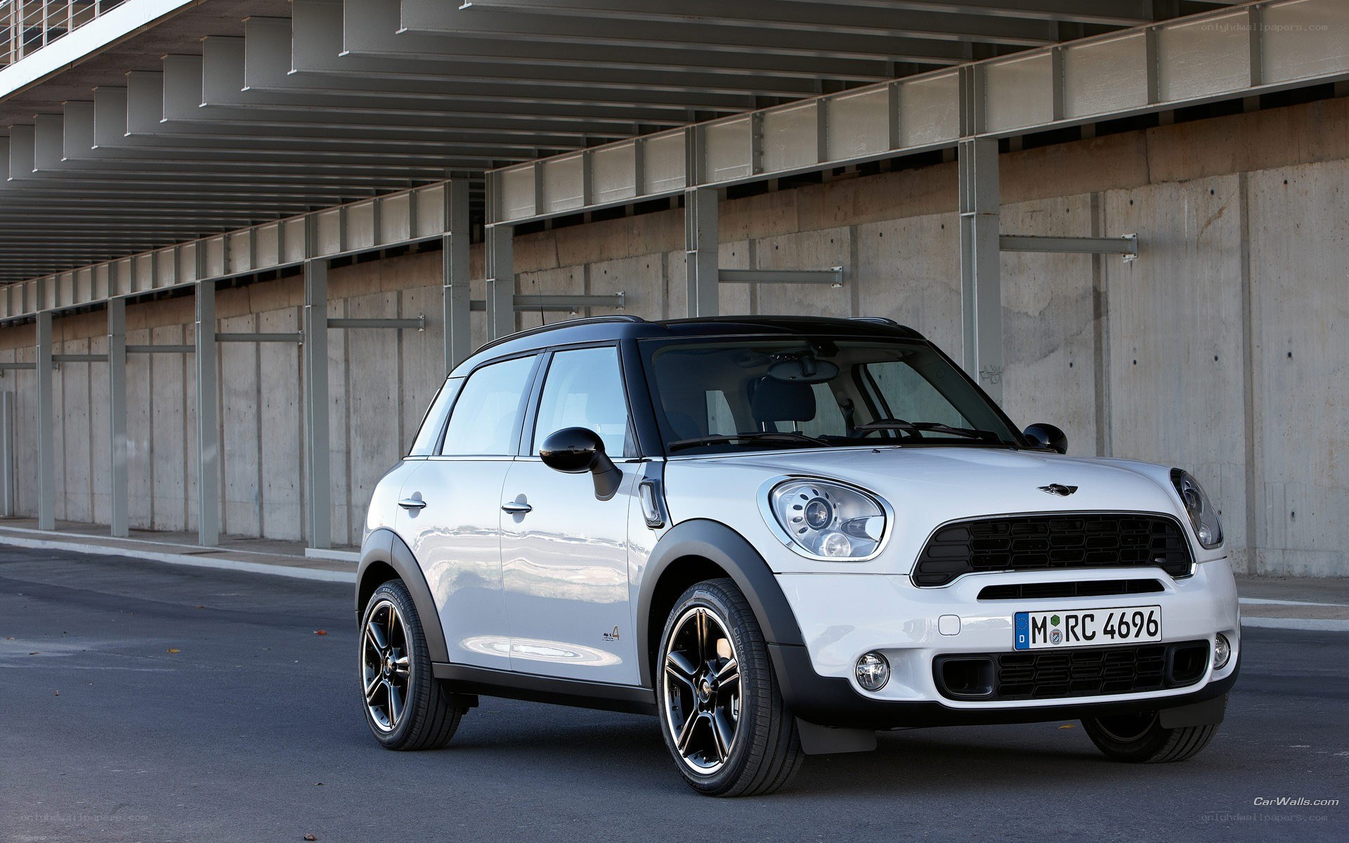 white mini cooper parked in garage