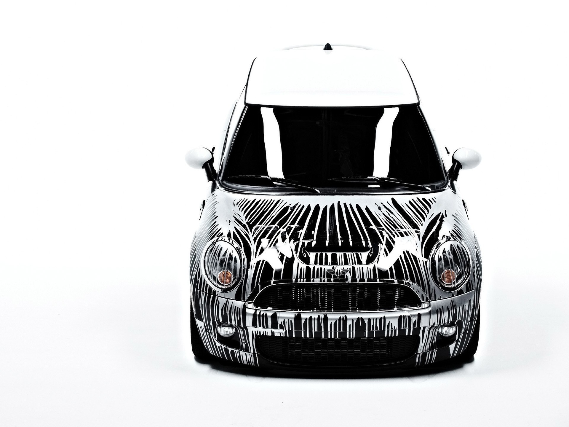white mini cooper with black art