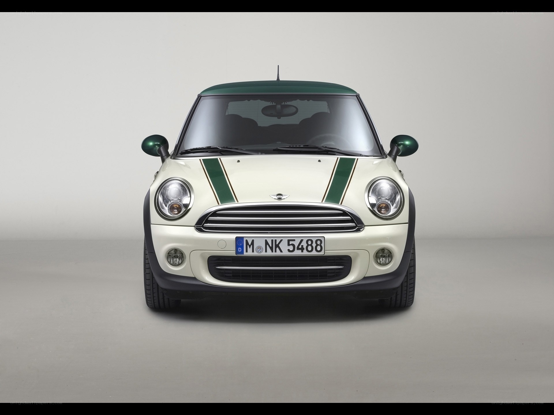 white mini cooper with green stripes