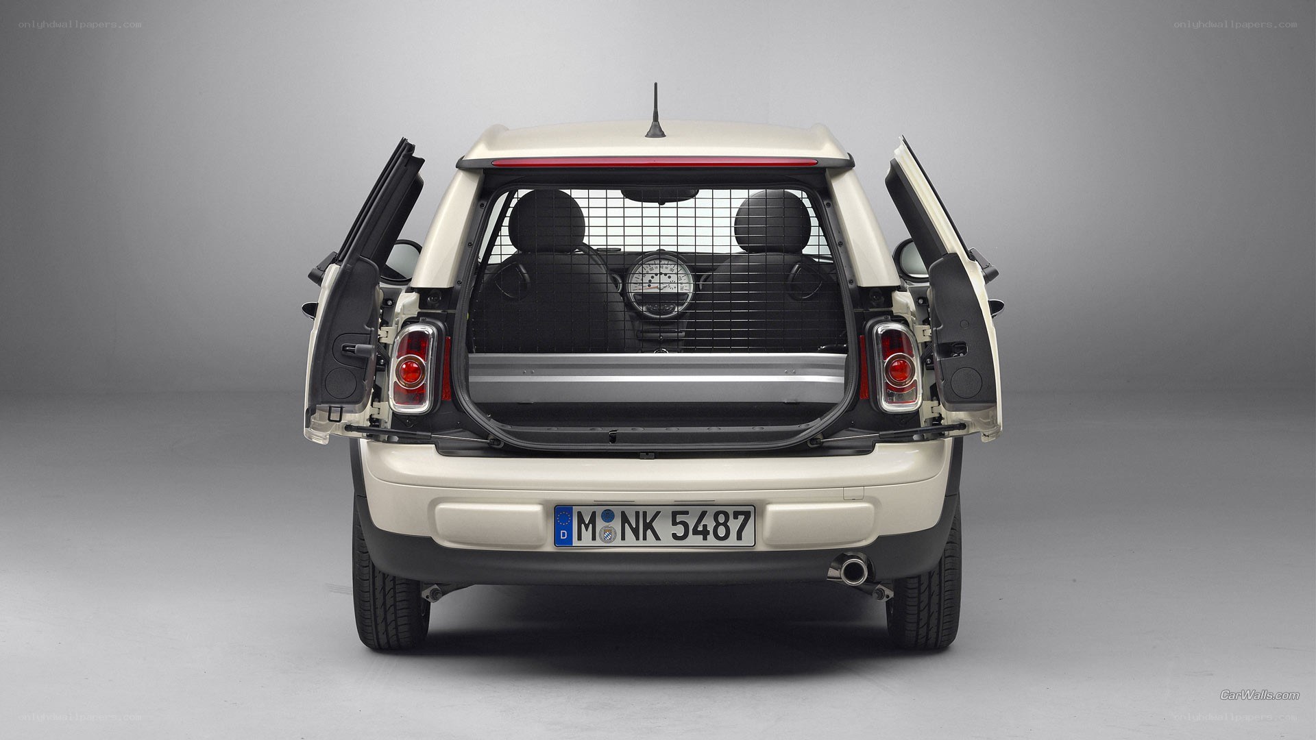 white mini cooper with open doors