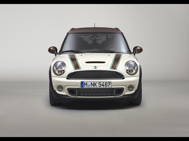 white mini cooper with racing stripes