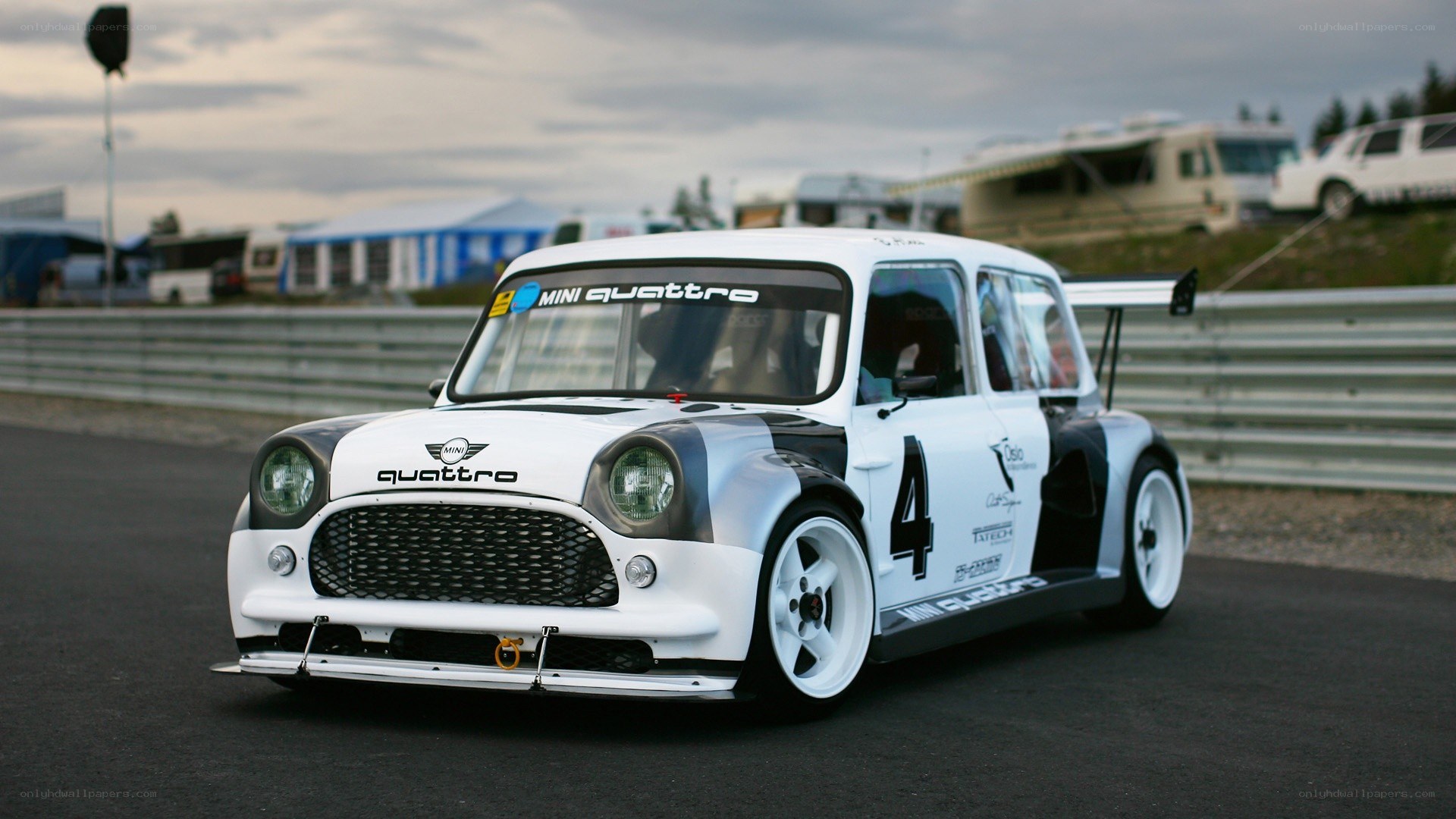 white mini race car on track