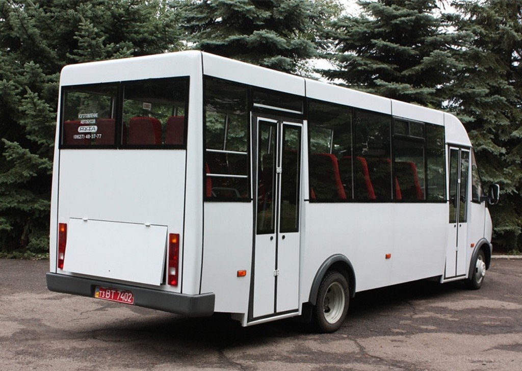 White minibus parked outdoors