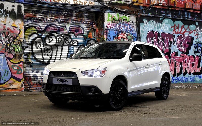 White Mitsubishi ASX in graffiti alley