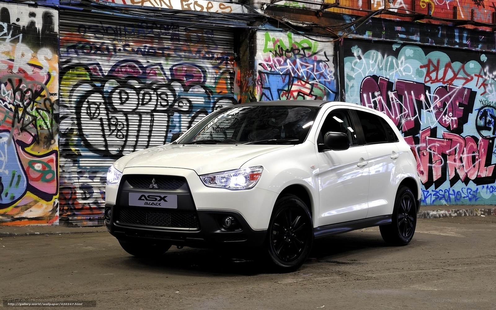 White Mitsubishi ASX in graffiti alley