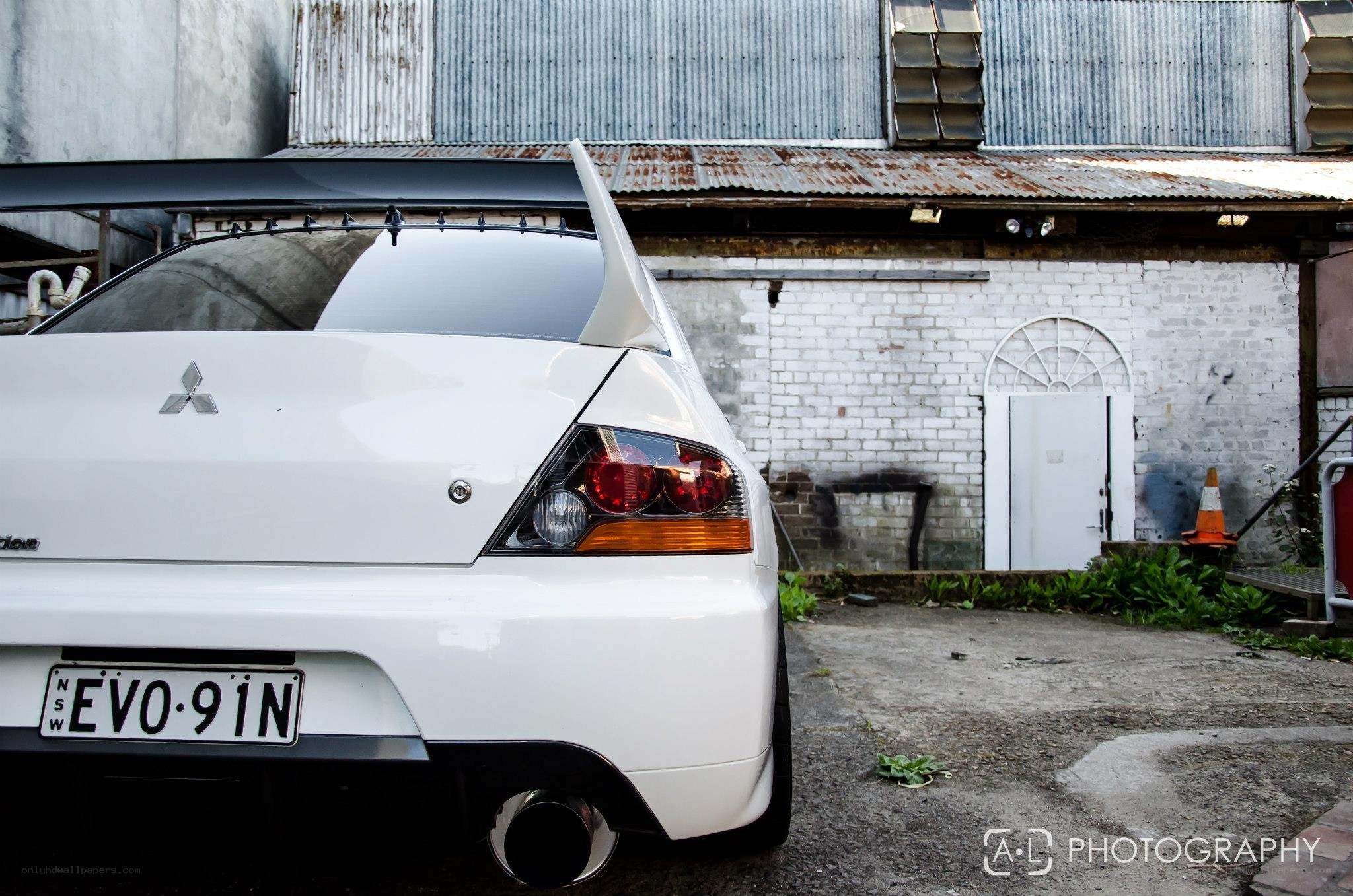 white mitsubishi evo rear view