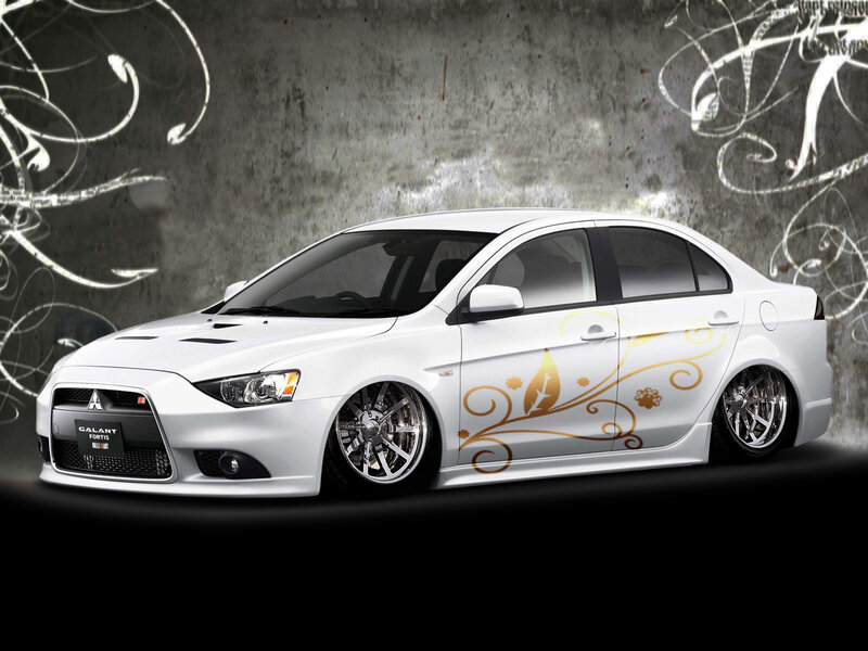 white mitsubishi galant with gold decals