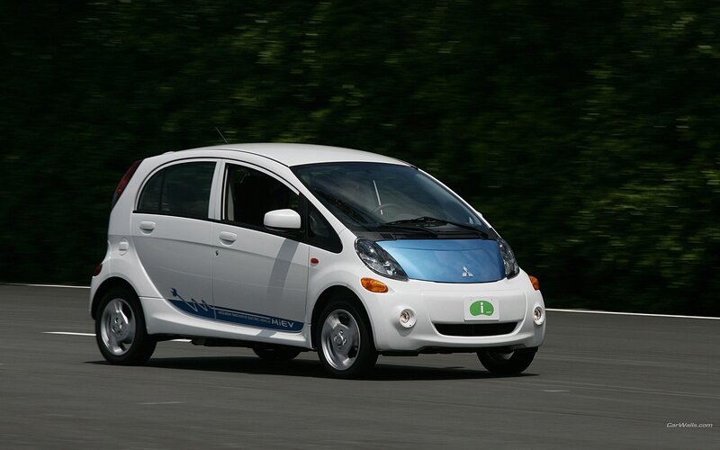 White Mitsubishi i-MiEV in motion