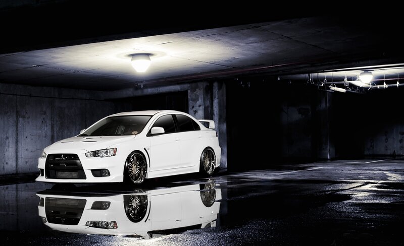 White Mitsubishi in parking garage