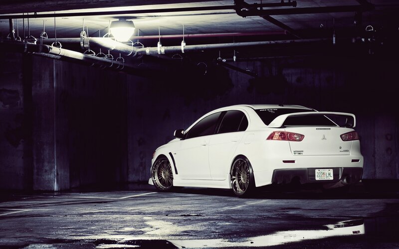 White Mitsubishi in parking garage