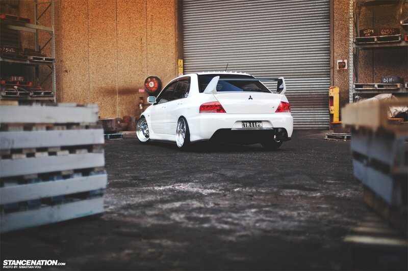 White Mitsubishi Lancer — Dramatic, Photograph, Car, Warehouse, Pallets