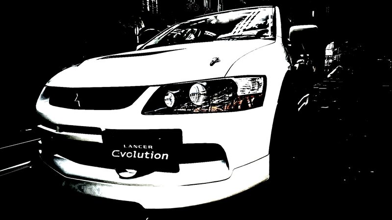 white mitsubishi lancer evolution